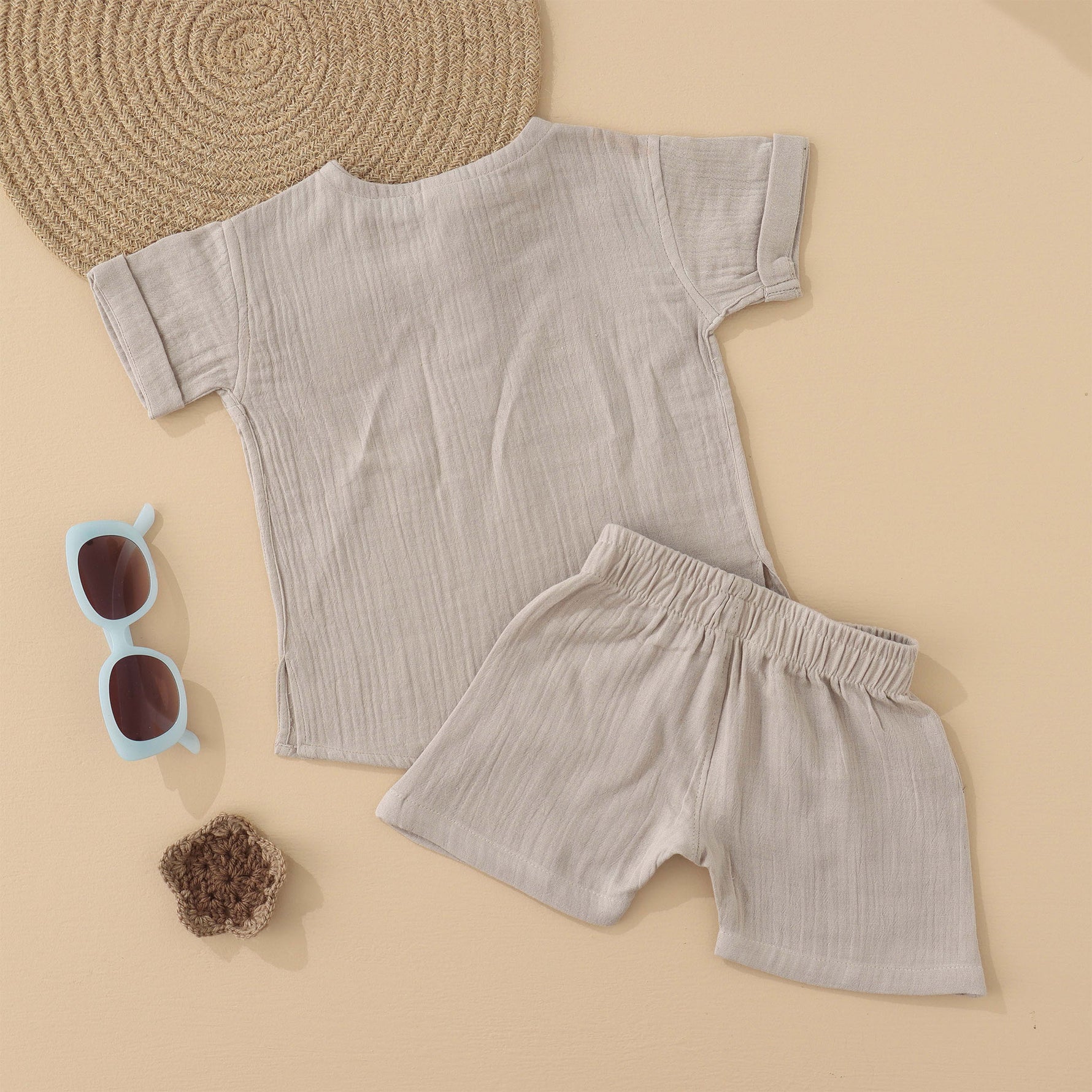 Beige baby boys’ muslin shirt and shorts set with hippo embroidery, made of soft crinkled muslin – Boon Babies eco-friendly summer wear from Coimbatore.
