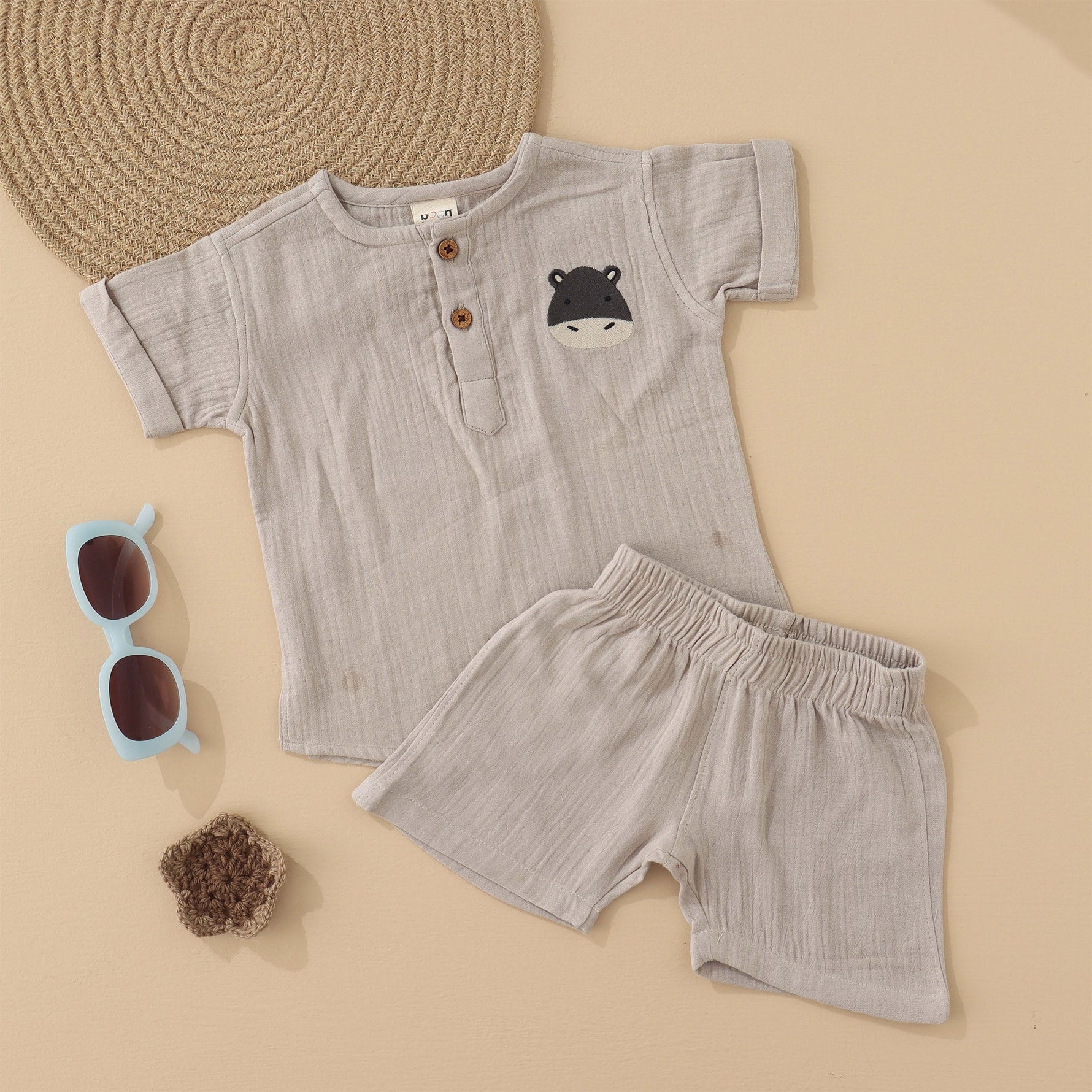 Beige baby boys’ muslin shirt and shorts set with hippo embroidery, made of soft crinkled muslin – Boon Babies eco-friendly summer wear from Coimbatore.
