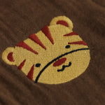 Olive green boys’ muslin shirt and shorts set with tiger face embroidery, wooden buttons, and elastic shorts – soft summer outfit by Boon Babies, Coimbatore.
