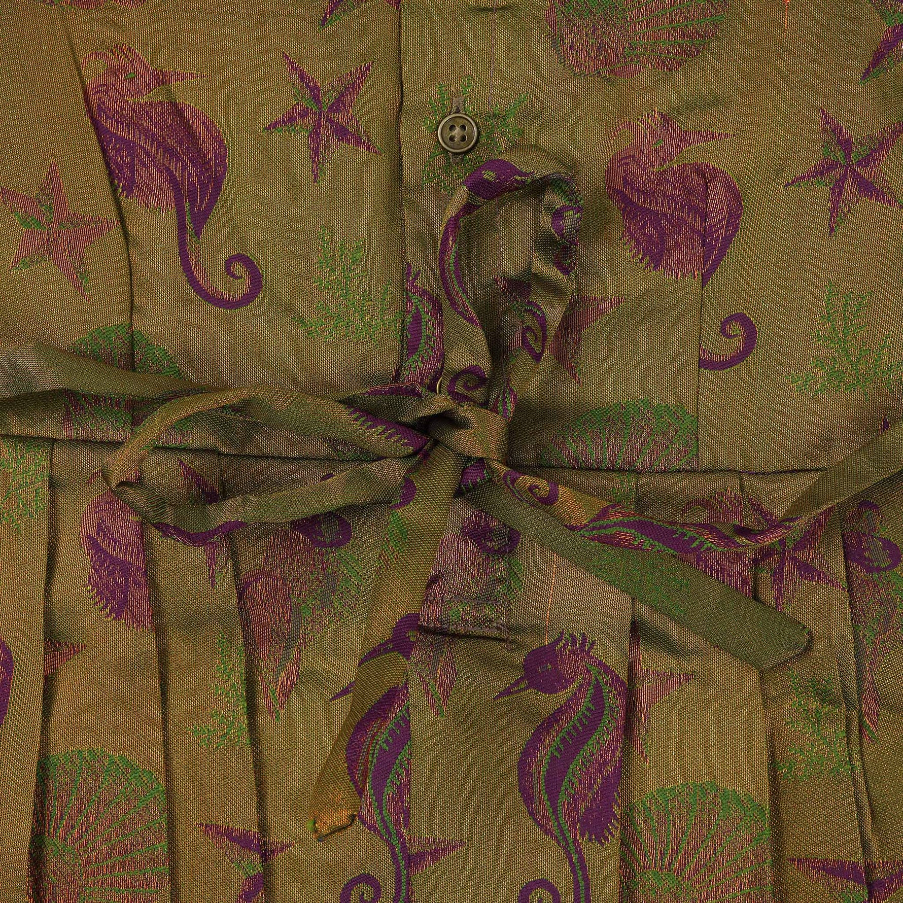 Traditional silk ethnic frock in olive green and maroon with festive motifs, perfect for girls aged 1 to 5 years. Elegant and comfortable for celebrations.