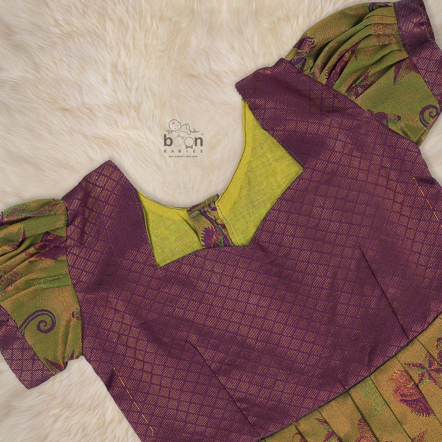 Traditional silk ethnic frock in olive green and maroon with festive motifs, perfect for girls aged 1 to 5 years. Elegant and comfortable for celebrations.
