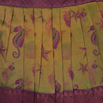 Traditional silk ethnic frock in olive green and maroon with festive motifs, perfect for girls aged 1 to 5 years. Elegant and comfortable for celebrations.