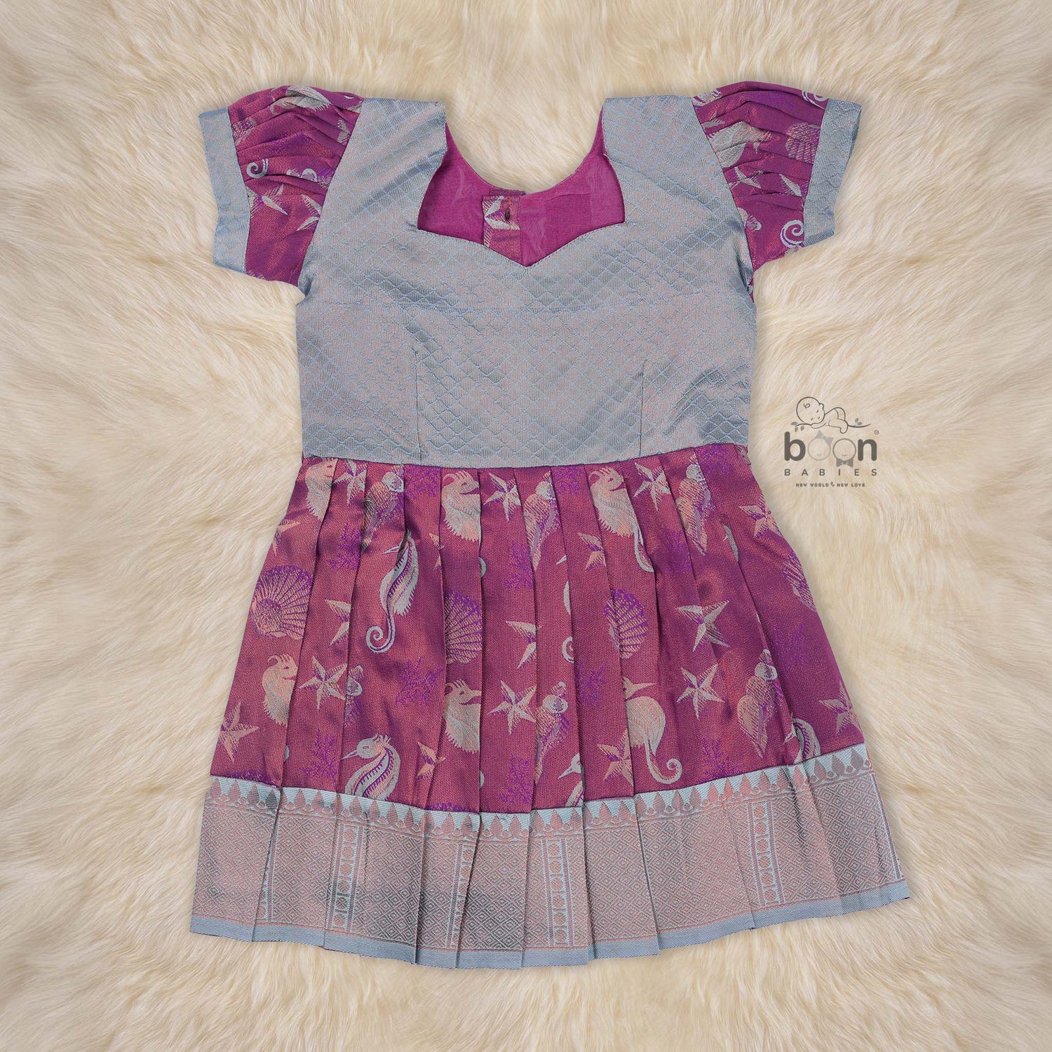 Elegant ethnic frock in purple and grey silk with seahorse-themed zari work, designed for girls aged 1 to 5 years. Traditional style, festive comfort.