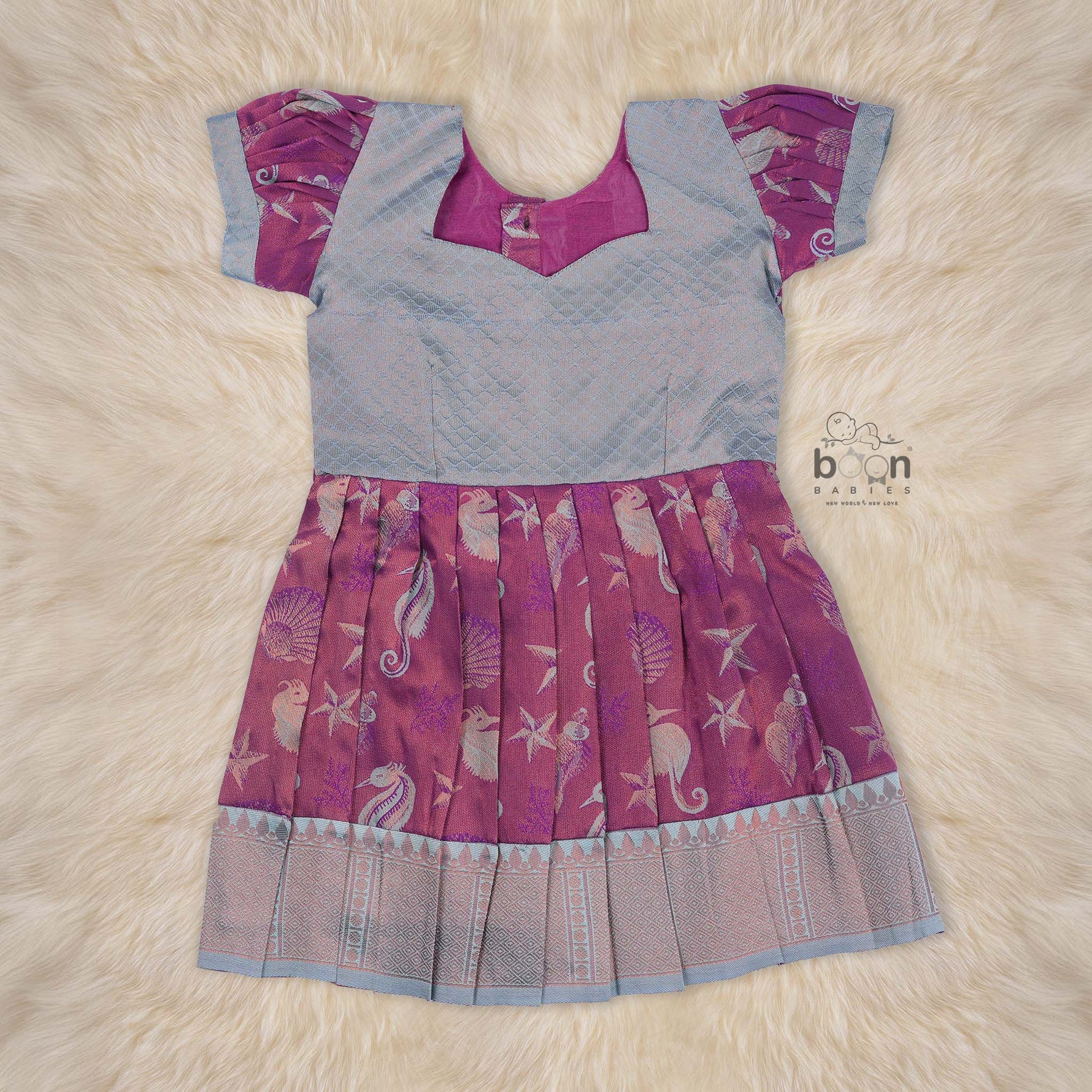 Elegant ethnic frock in purple and grey silk with seahorse-themed zari work, designed for girls aged 1 to 5 years. Traditional style, festive comfort.