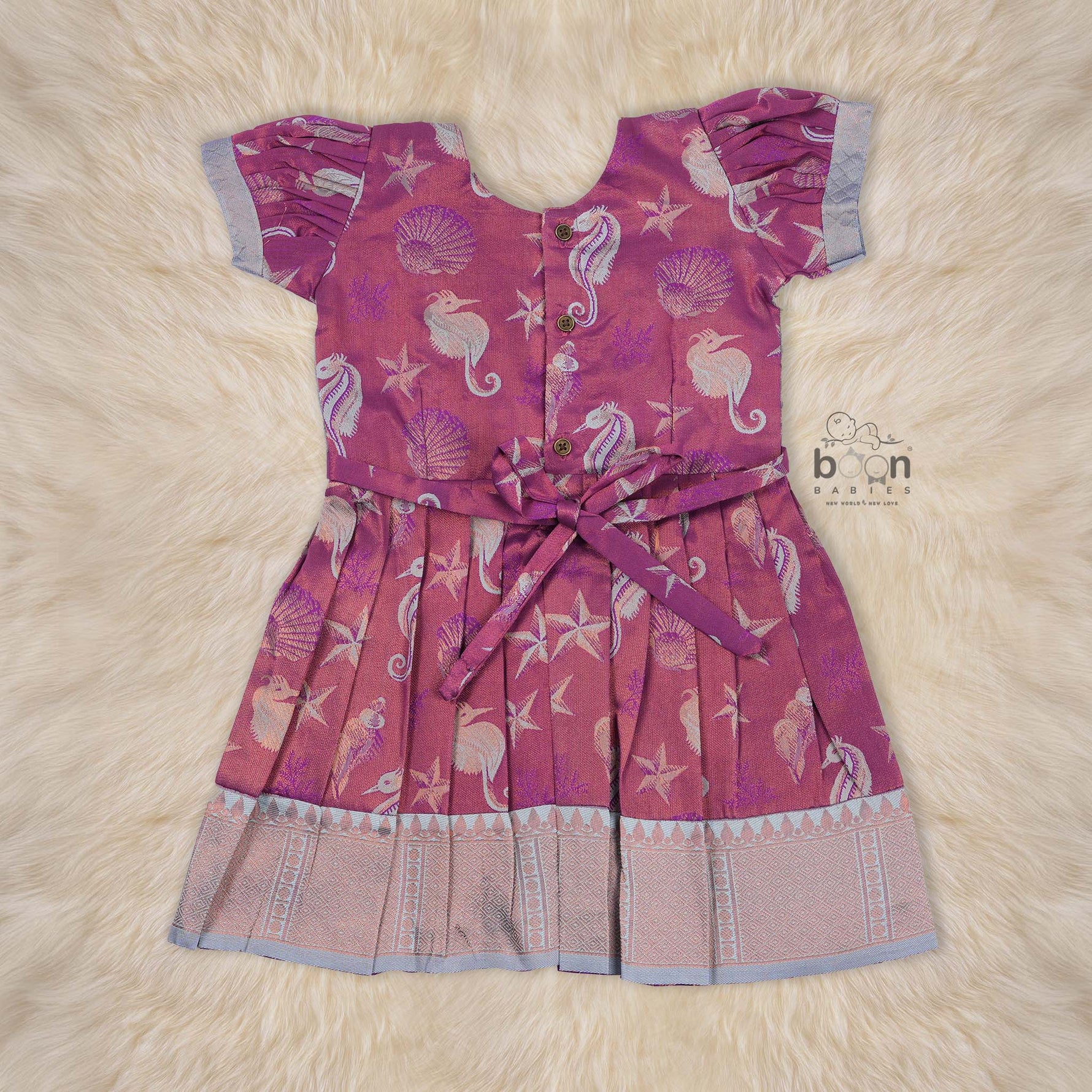 Elegant ethnic frock in purple and grey silk with seahorse-themed zari work, designed for girls aged 1 to 5 years. Traditional style, festive comfort.
