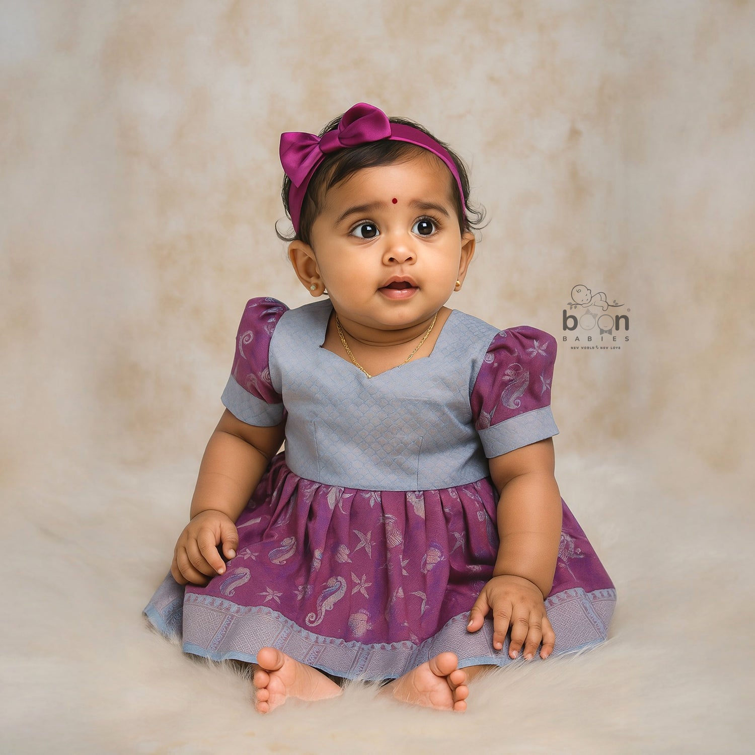 Elegant ethnic frock in purple and grey silk with seahorse-themed zari work, designed for girls aged 1 to 5 years. Traditional style, festive comfort.