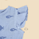 Baby romper in soft blue crinkled muslin with navy fish prints and snap buttons – perfect for 0 to 12 months, from Boon Babies, Coimbatore.