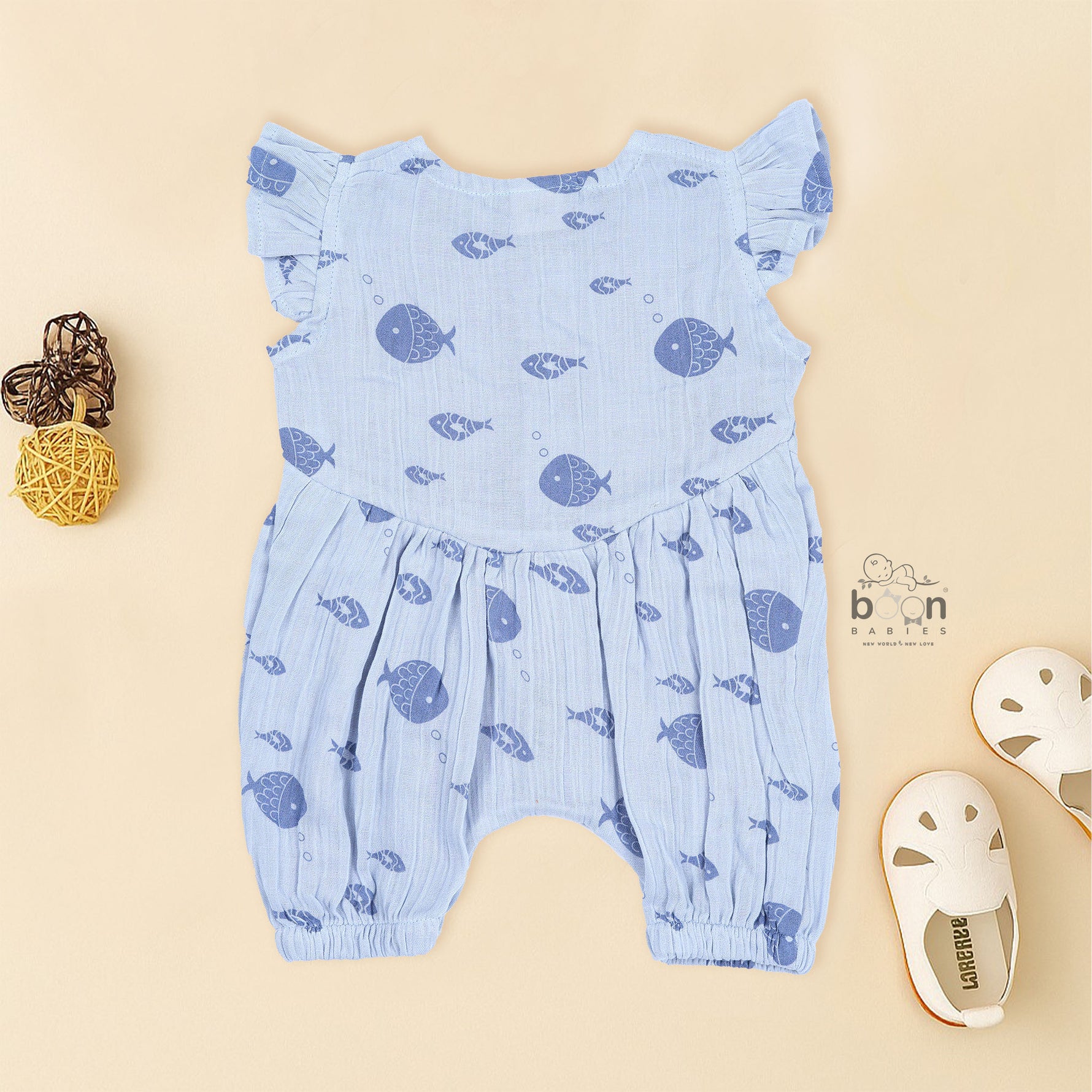 Baby romper in soft blue crinkled muslin with navy fish prints and snap buttons – perfect for 0 to 12 months, from Boon Babies, Coimbatore.