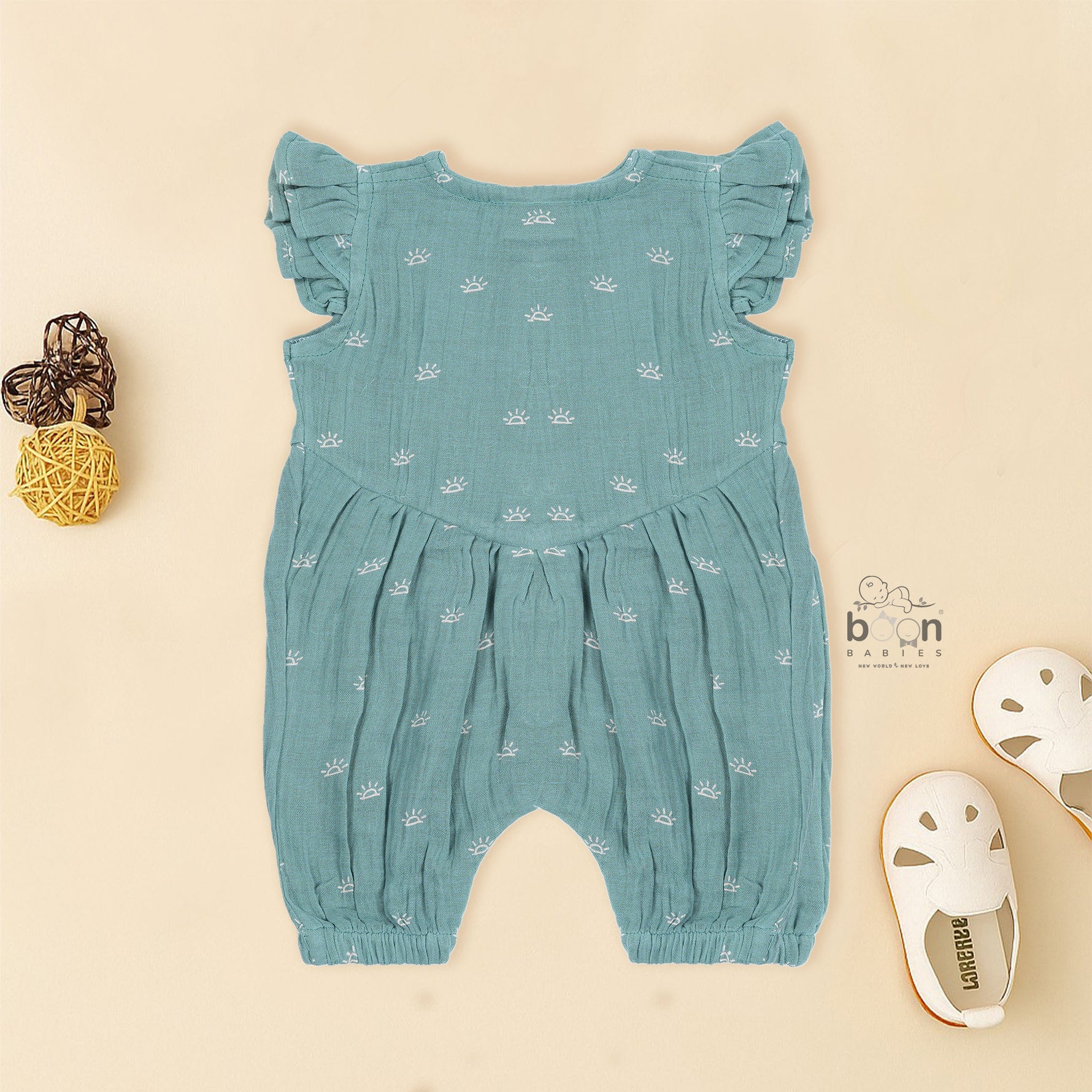 Crinkled muslin baby romper in dusty green with white sun print and flutter sleeves – perfect for 0 to 12 months, from Boon Babies baby cloths collection in Coimbatore.