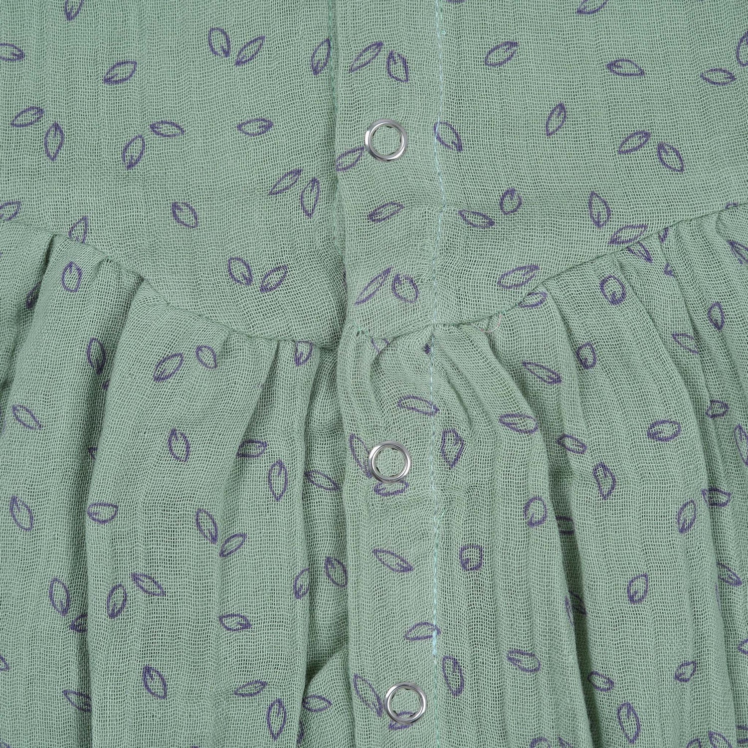 Mint green baby romper in crinkled muslin with leafy print and flutter sleeves, designed for newborns aged 0 to 12 months – Boon Babies Coimbatore collection.