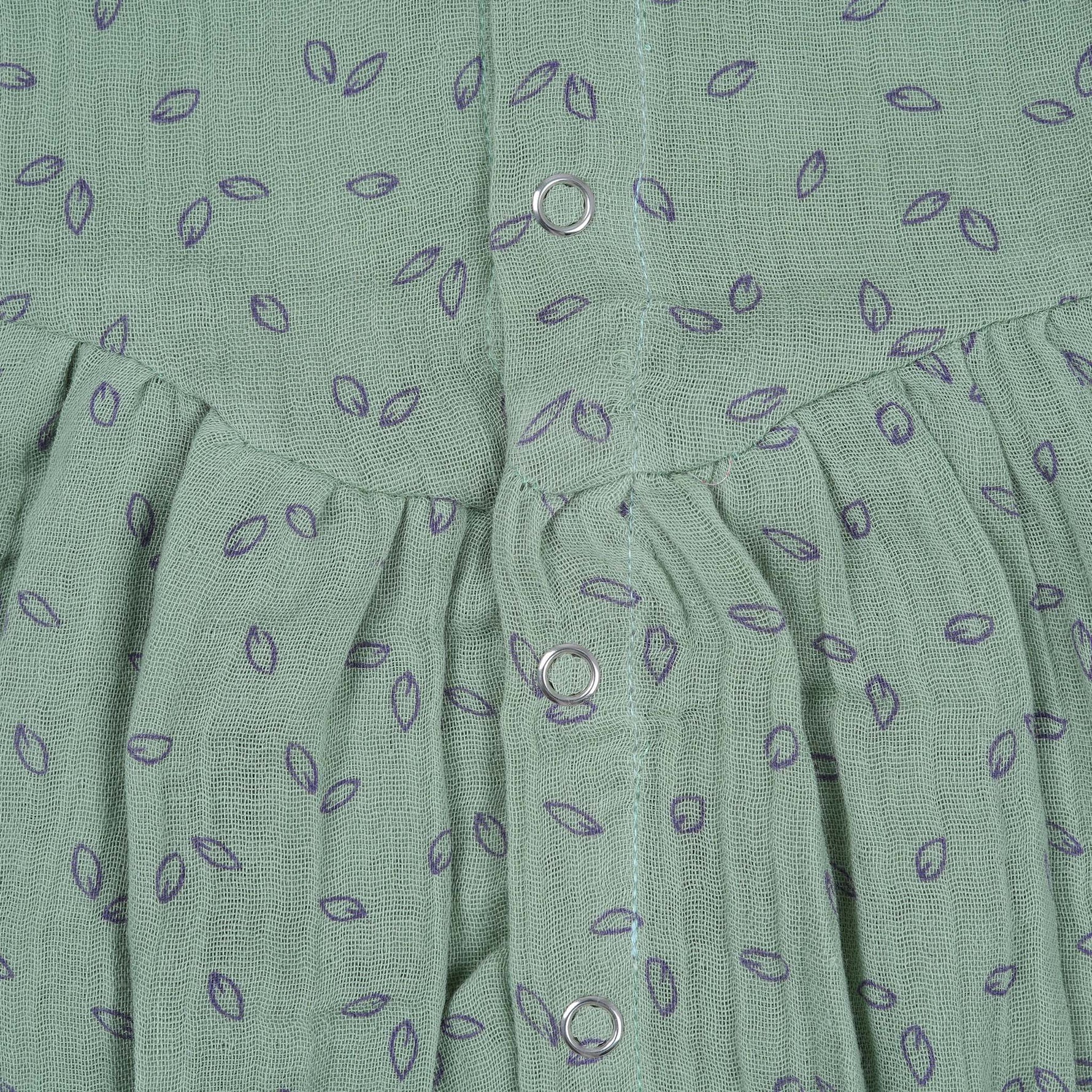 Mint green baby romper in crinkled muslin with leafy print and flutter sleeves, designed for newborns aged 0 to 12 months – Boon Babies Coimbatore collection.