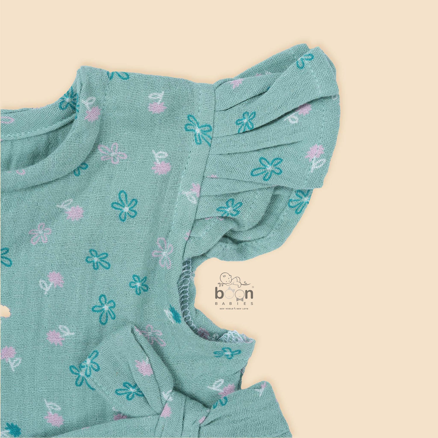 Teal blue floral crinkled muslin baby romper by Booon Babies, soft and stylish for 0-6 months, gentle on baby's skin.