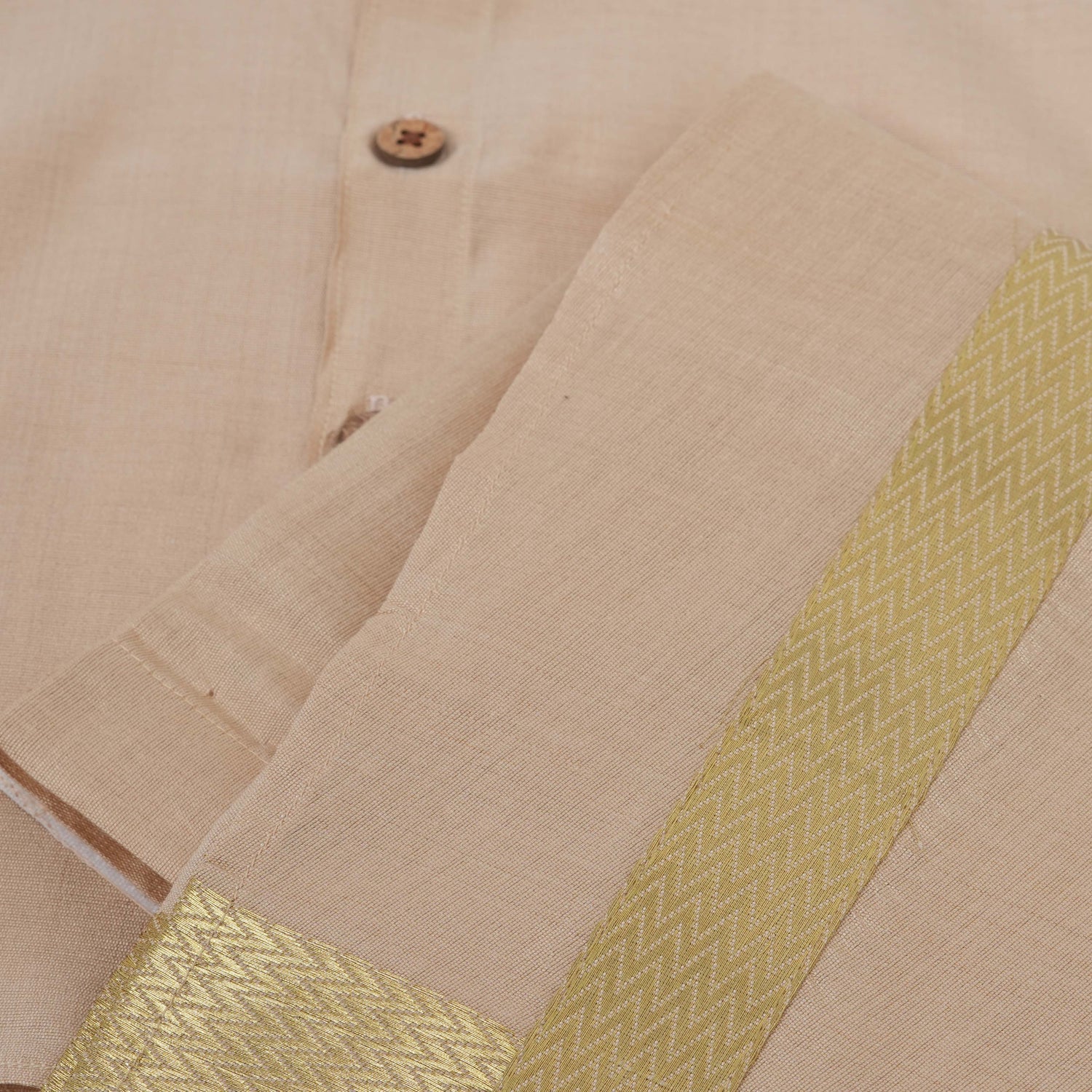 Beige-gold silk shirt & dhoti with golden zari border for boys aged 6M–5Y. Traditional festive wear for Onam, weddings & celebrations.