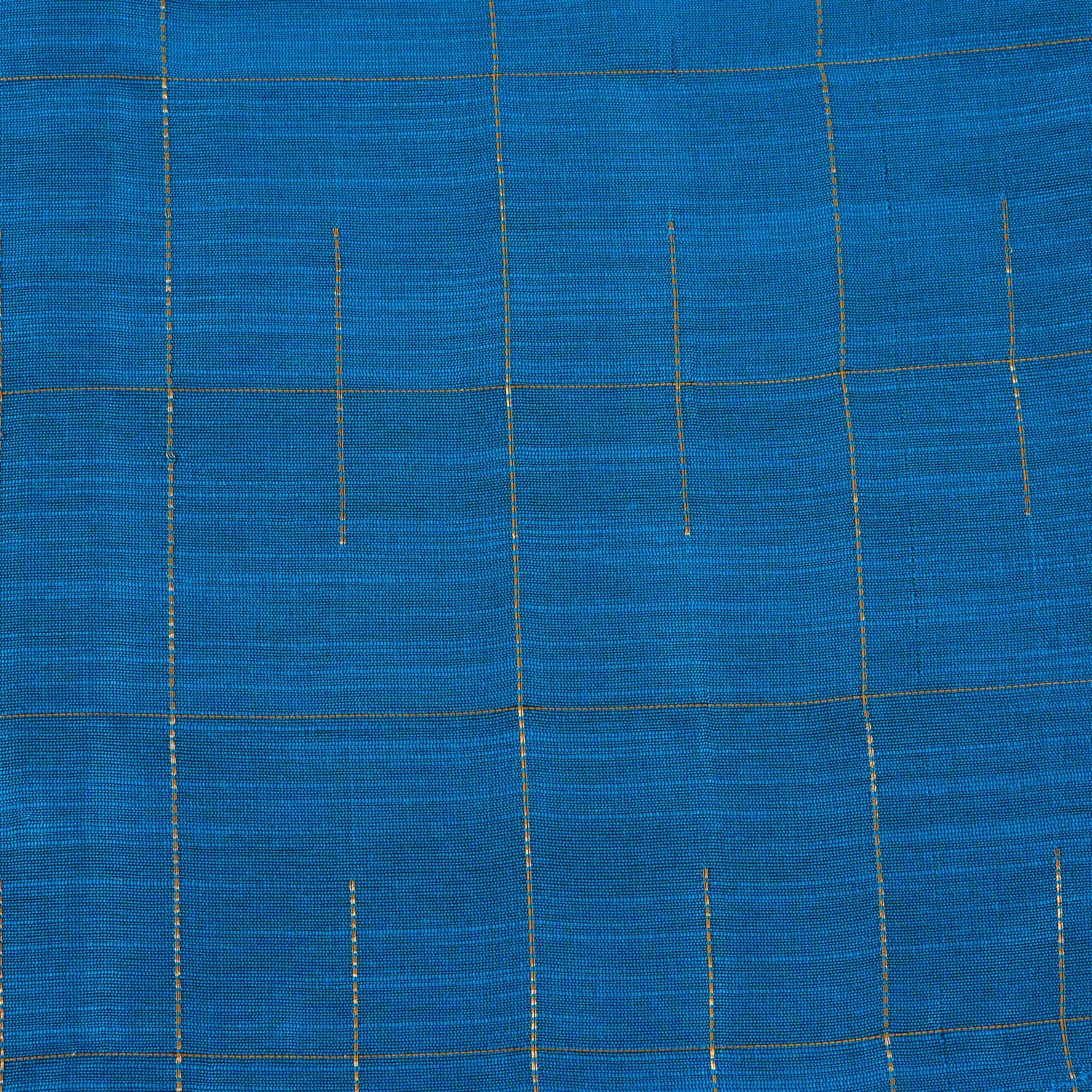 Boys festive outfit featuring a royal blue checked silk shirt and white dhoti with gold border – traditional South Indian attire by Boon Babies.
