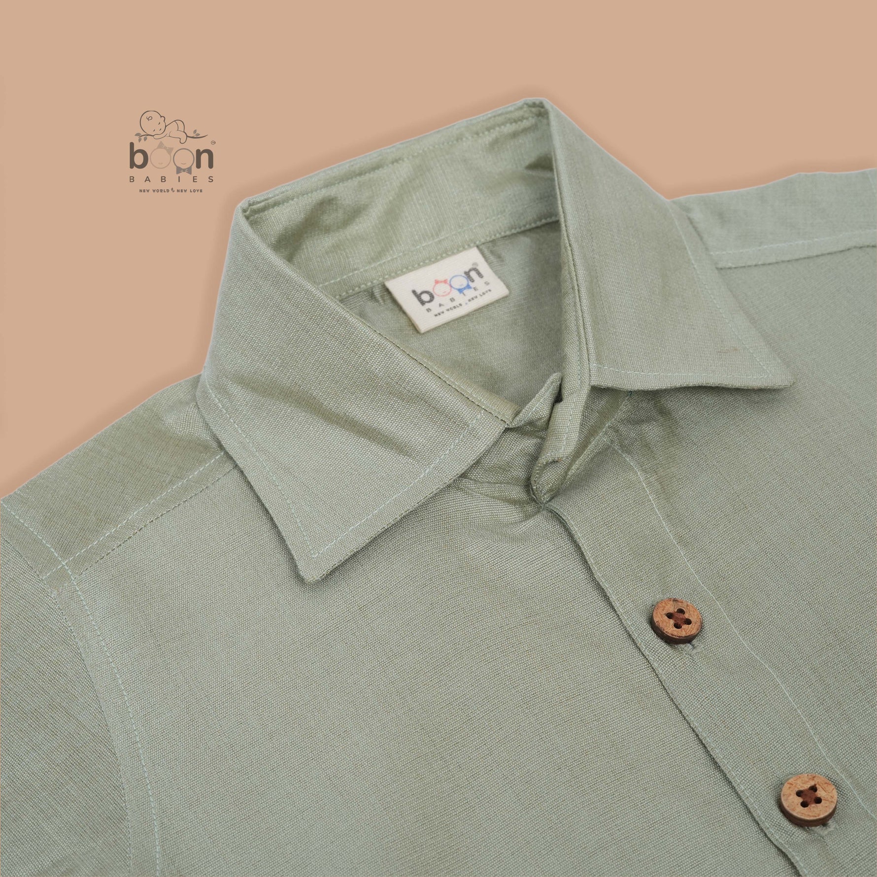 Green-silver silk shirt & dhoti with golden zari border for boys aged 6M–5Y. Perfect festive outfit for Onam & traditional celebrations.