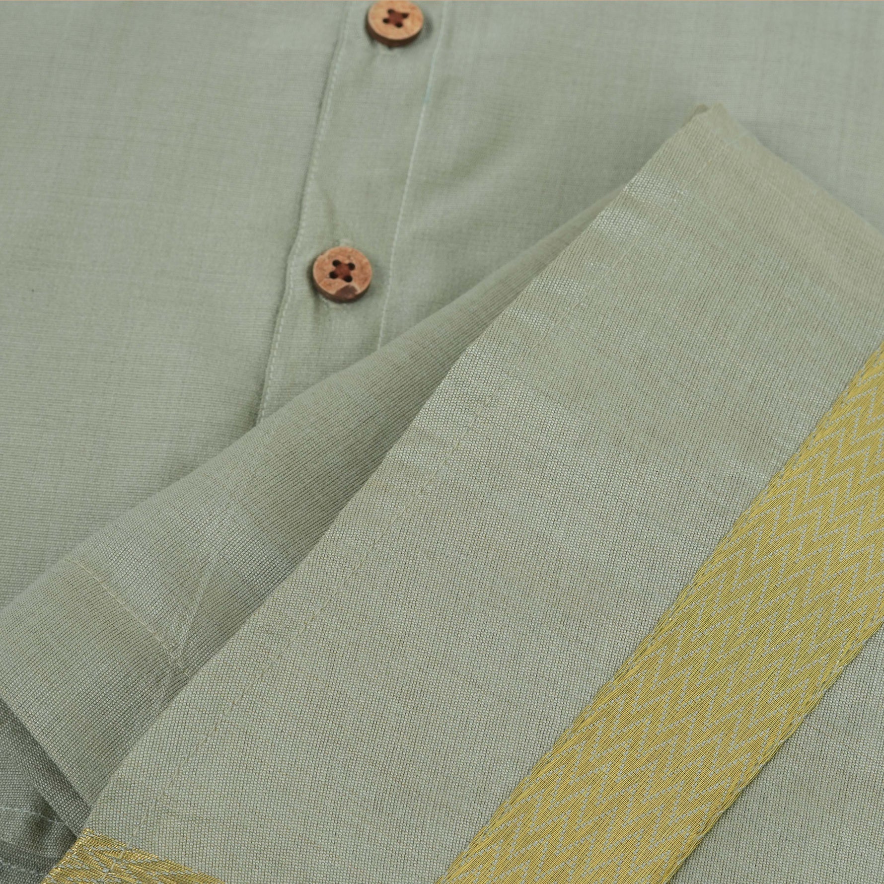 Green-silver silk shirt & dhoti with golden zari border for boys aged 6M–5Y. Perfect festive outfit for Onam & traditional celebrations.