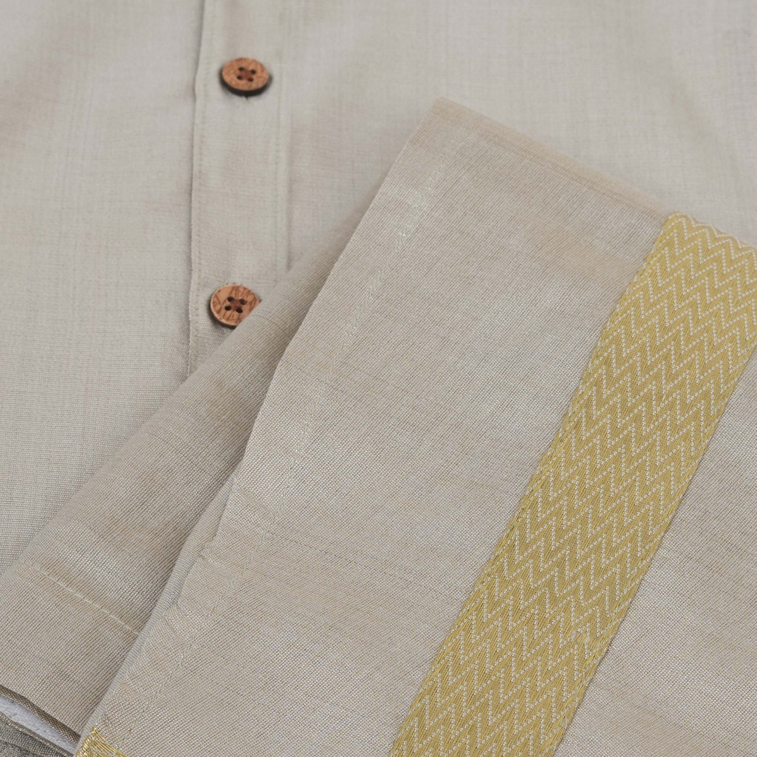 Silver silk shirt & dhoti set with golden zari border for boys aged 6M–5Y. Ideal festive wear for Onam & celebrations.