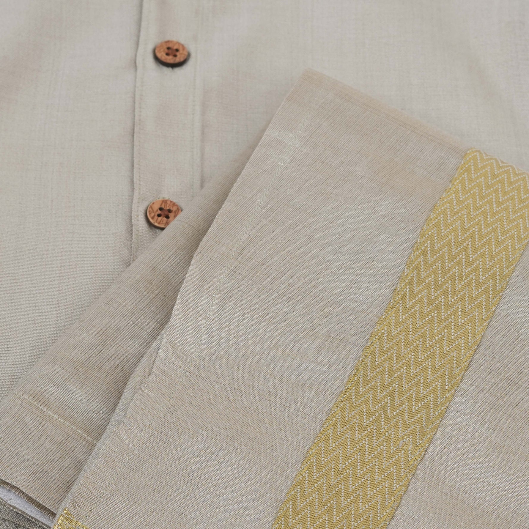 Silver silk shirt & dhoti set with golden zari border for boys aged 6M–5Y. Ideal festive wear for Onam & celebrations.