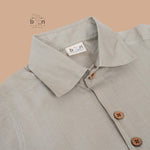 Silver silk shirt & dhoti set with golden zari border for boys aged 6M–5Y. Ideal festive wear for Onam & celebrations.