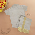 Silver silk shirt & dhoti set with golden zari border for boys aged 6M–5Y. Ideal festive wear for Onam & celebrations.