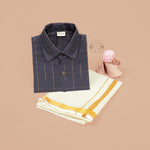 Boys ethnic silk shirt in navy with checked pattern paired with white and gold bordered dhoti, displayed flatlay style – festive wear from Boon Babies.
