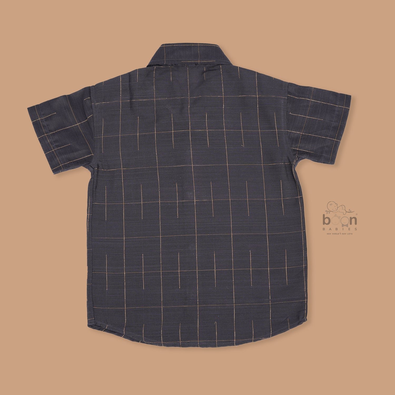 Boys ethnic silk shirt in navy with checked pattern paired with white and gold bordered dhoti, displayed flatlay style – festive wear from Boon Babies.
