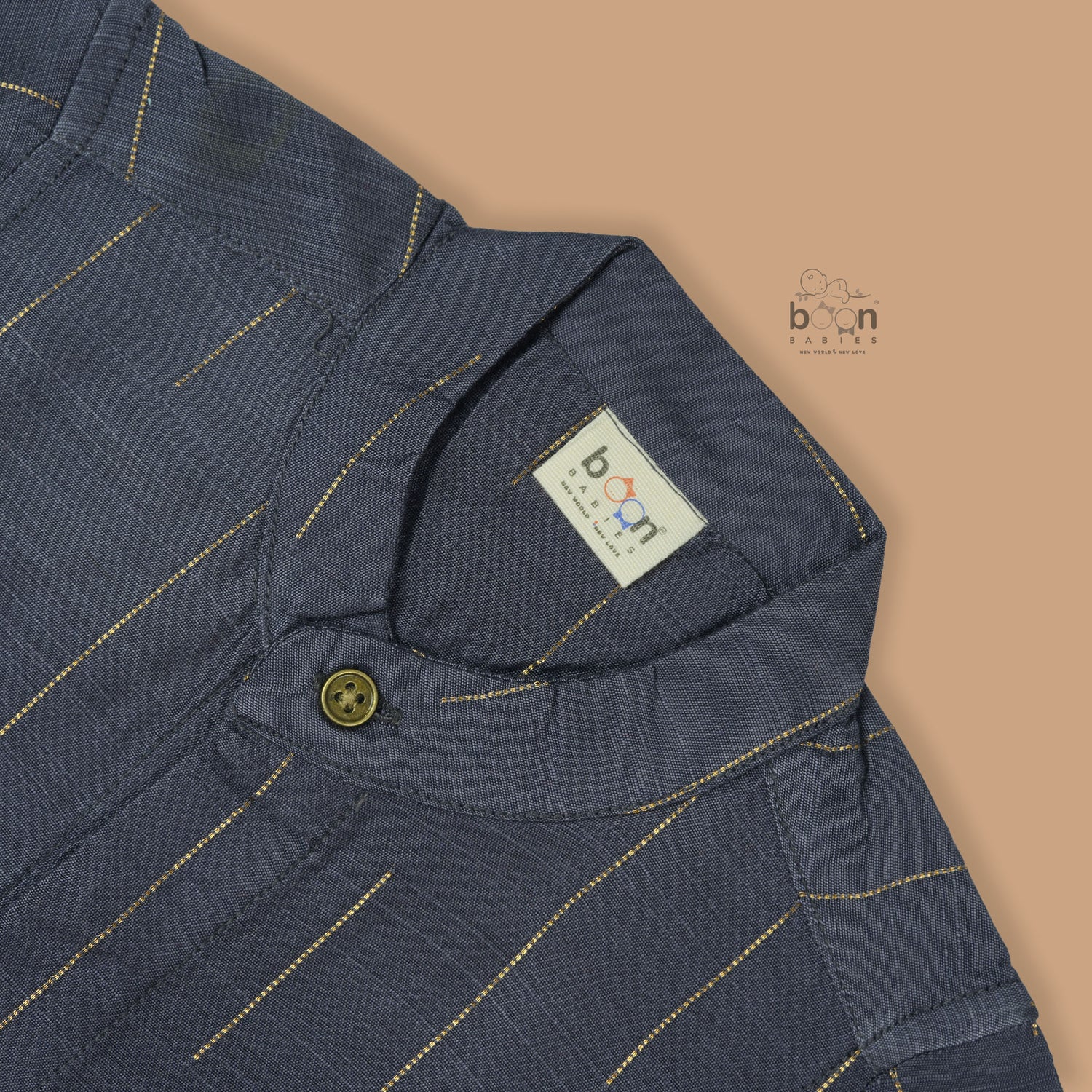 Boys ethnic silk shirt in navy with checked pattern paired with white and gold bordered dhoti, displayed flatlay style – festive wear from Boon Babies.
