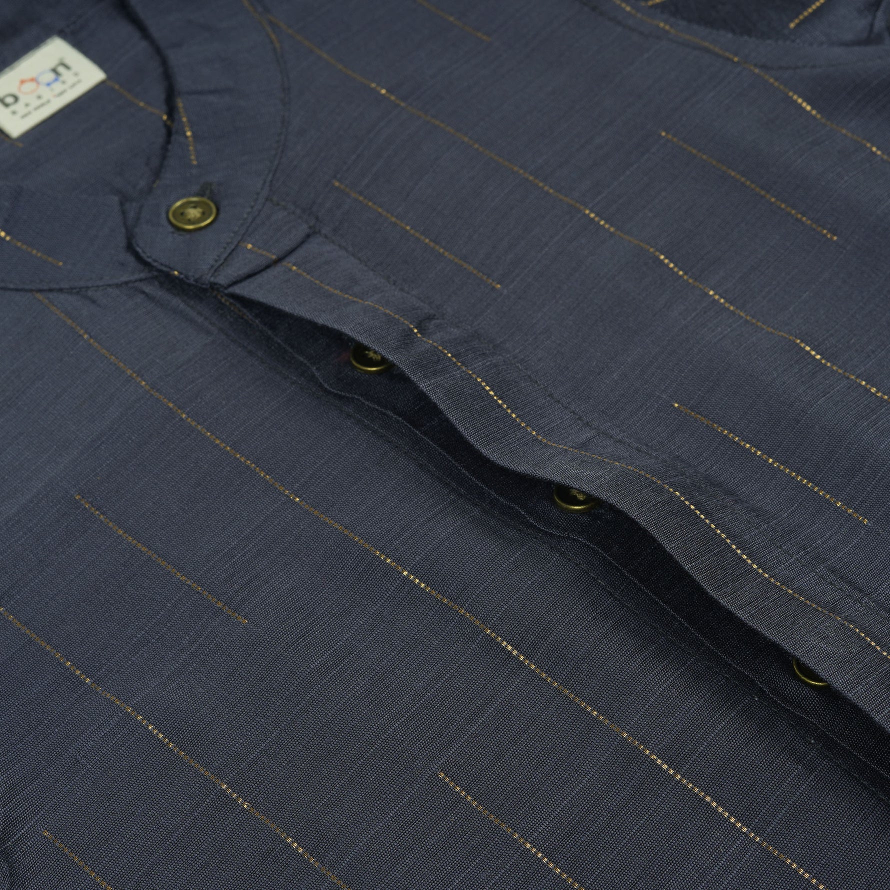 Boys ethnic silk shirt in navy with checked pattern paired with white and gold bordered dhoti, displayed flatlay style – festive wear from Boon Babies.
