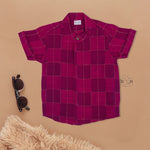 Magenta checked silk shirt with Chinese collar and white dhoti with gold border – boys festive ethnic outfit from Boon Babies.
