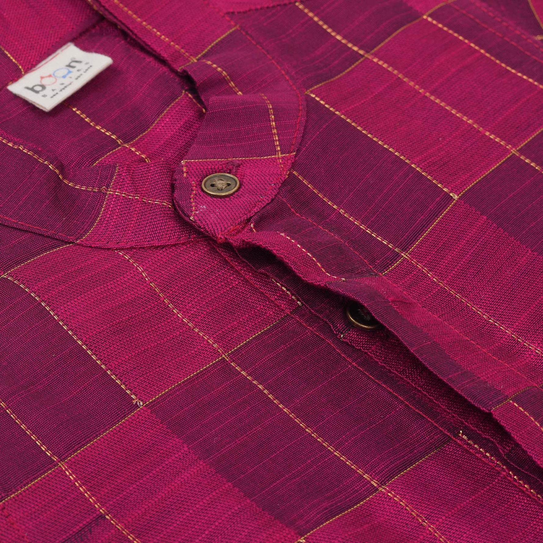 Magenta checked silk shirt with Chinese collar and white dhoti with gold border – boys festive ethnic outfit from Boon Babies.
