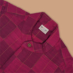 Magenta checked silk shirt with Chinese collar and white dhoti with gold border – boys festive ethnic outfit from Boon Babies.
