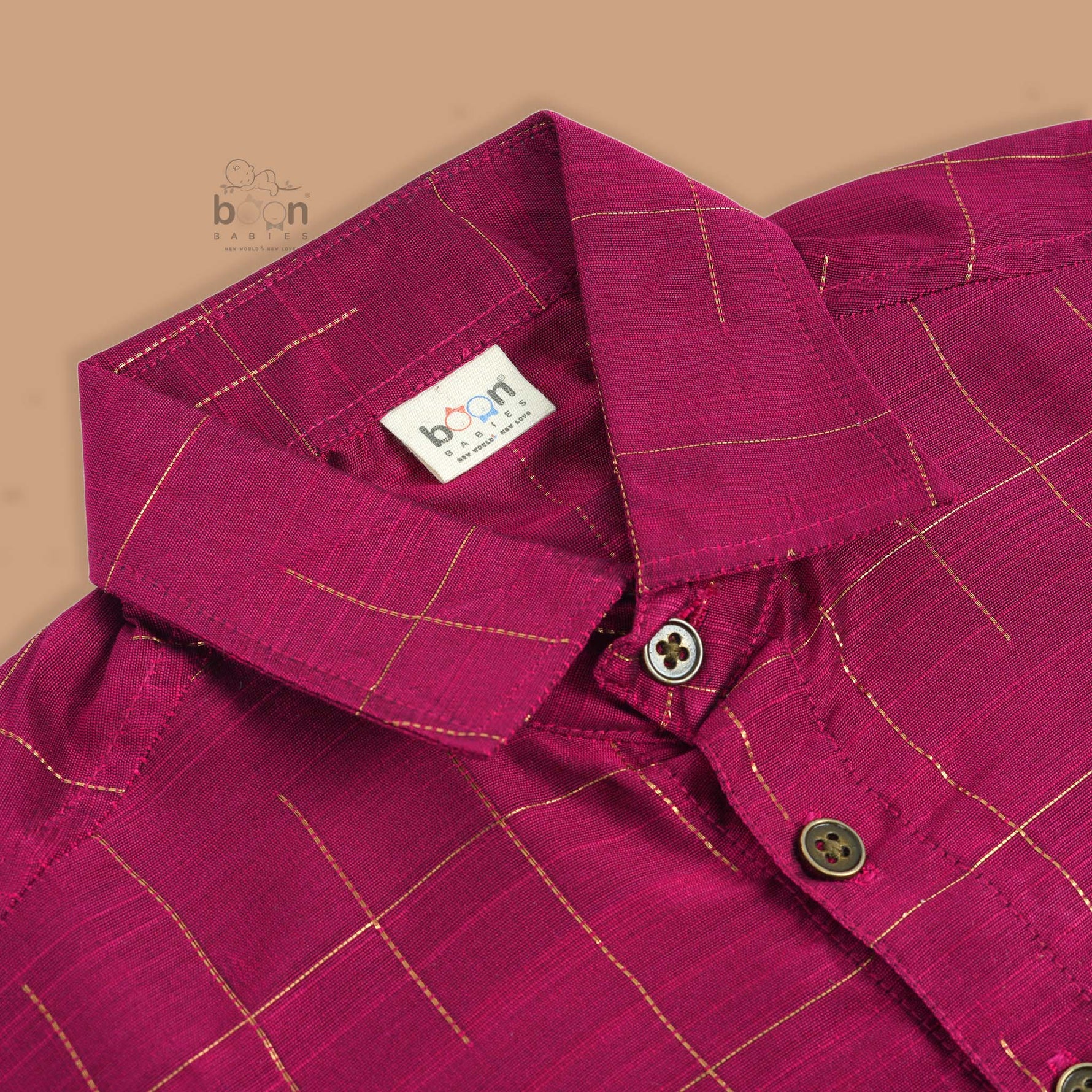 Boys festive outfit with maroon silk checked shirt and white dhoti with gold border – ethnic South Indian look from Boon Babies.
