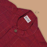 Maroon silk checked shirt with Chinese collar paired with golden border cream dhoti – traditional boys ethnic wear from Boon Babies for 6 months to 5 years.
