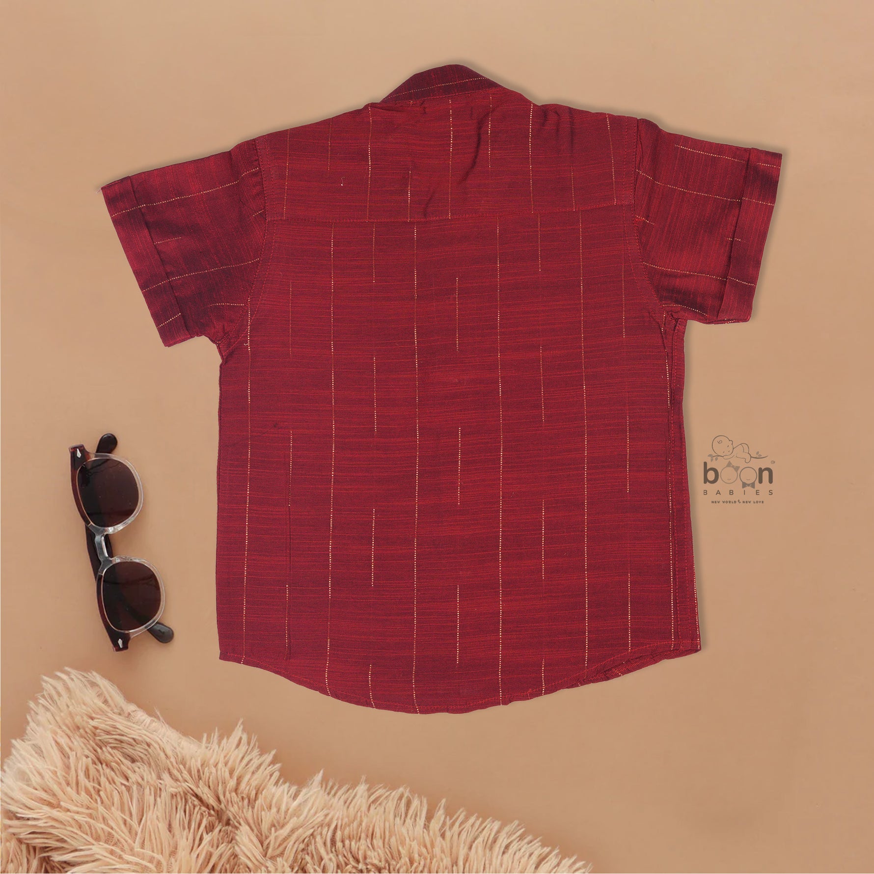 Maroon silk checked shirt with Chinese collar paired with golden border cream dhoti – traditional boys ethnic wear from Boon Babies for 6 months to 5 years.
