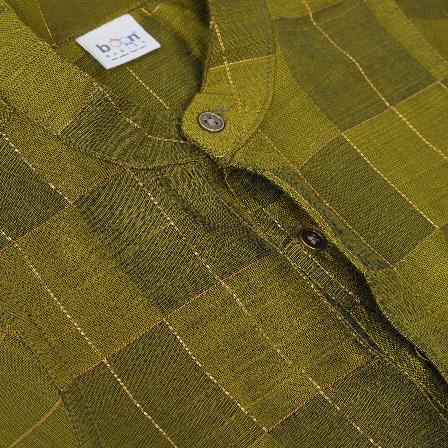 Olive green Chinese collar checked silk shirt with matching white dhoti and gold border – boys festive traditional wear by Boon Babies.
