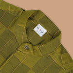 Olive green Chinese collar checked silk shirt with matching white dhoti and gold border – boys festive traditional wear by Boon Babies.
