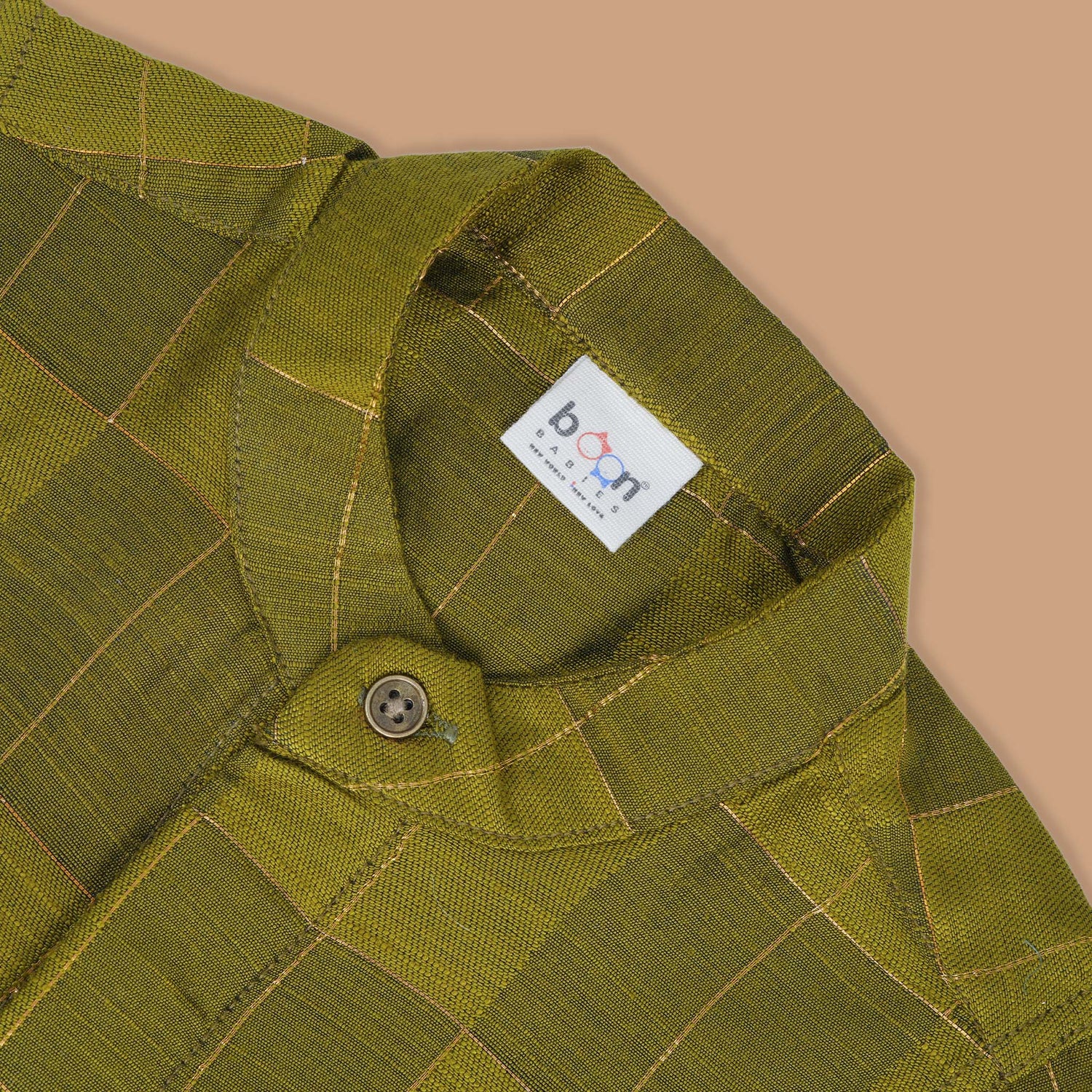 Olive green Chinese collar checked silk shirt with matching white dhoti and gold border – boys festive traditional wear by Boon Babies.

