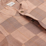 Peach checked silk Chinese collar shirt with white and gold bordered dhoti – boys traditional festive outfit from Boon Babies.
