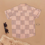 Peach checked silk Chinese collar shirt with white and gold bordered dhoti – boys traditional festive outfit from Boon Babies.
