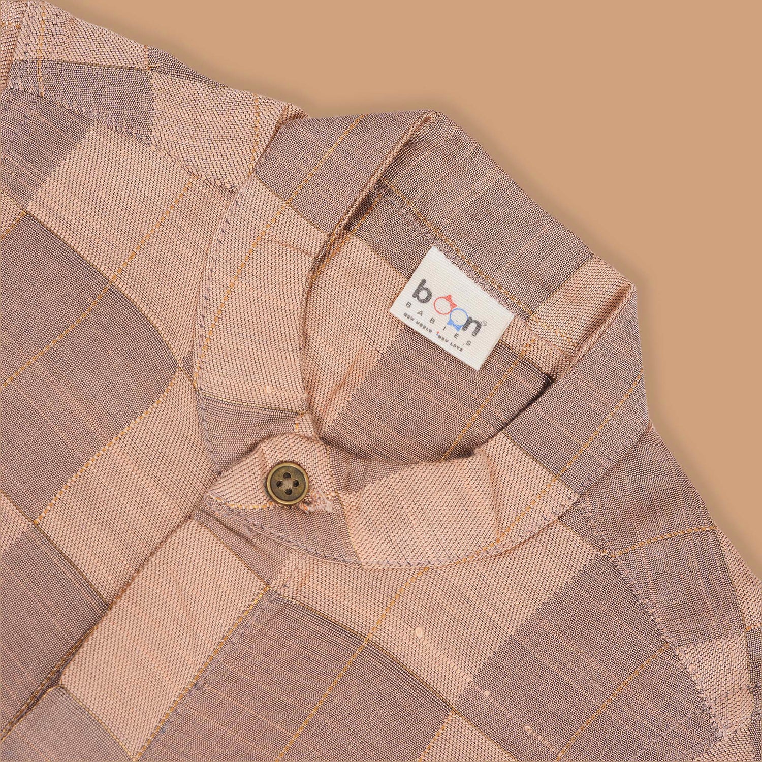 Peach checked silk Chinese collar shirt with white and gold bordered dhoti – boys traditional festive outfit from Boon Babies.
