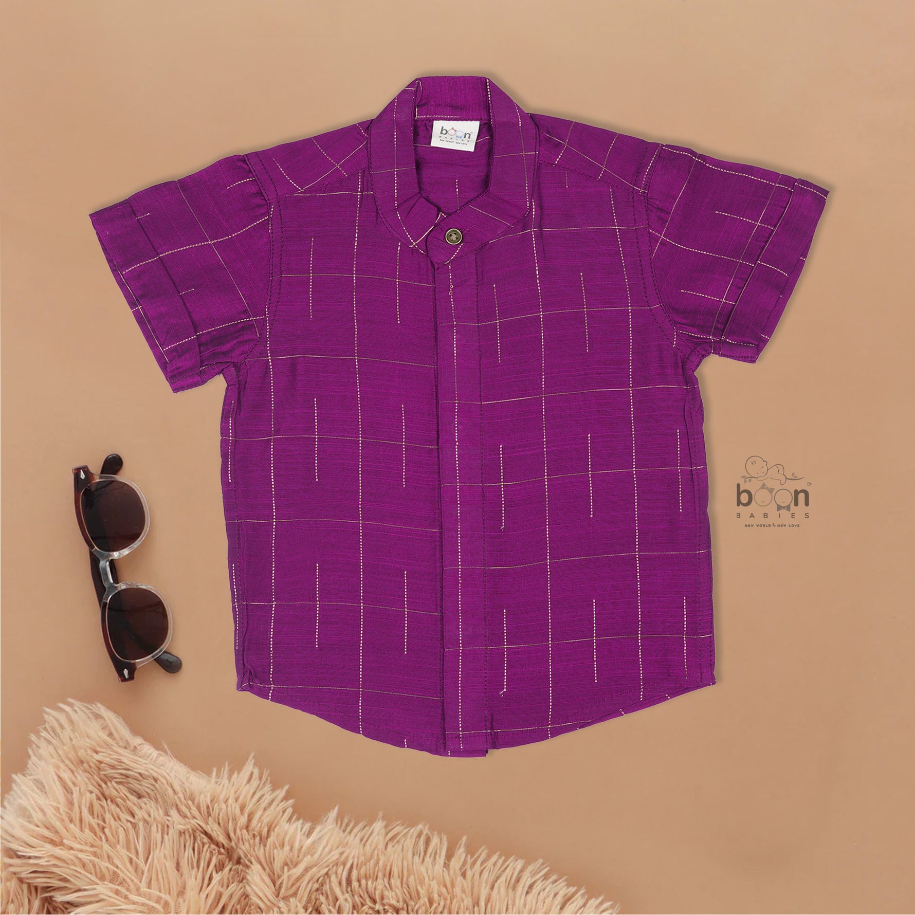 Purple checked silk shirt with Chinese collar and white dhoti with gold zari border – festive traditional wear for boys from Boon Babies.
