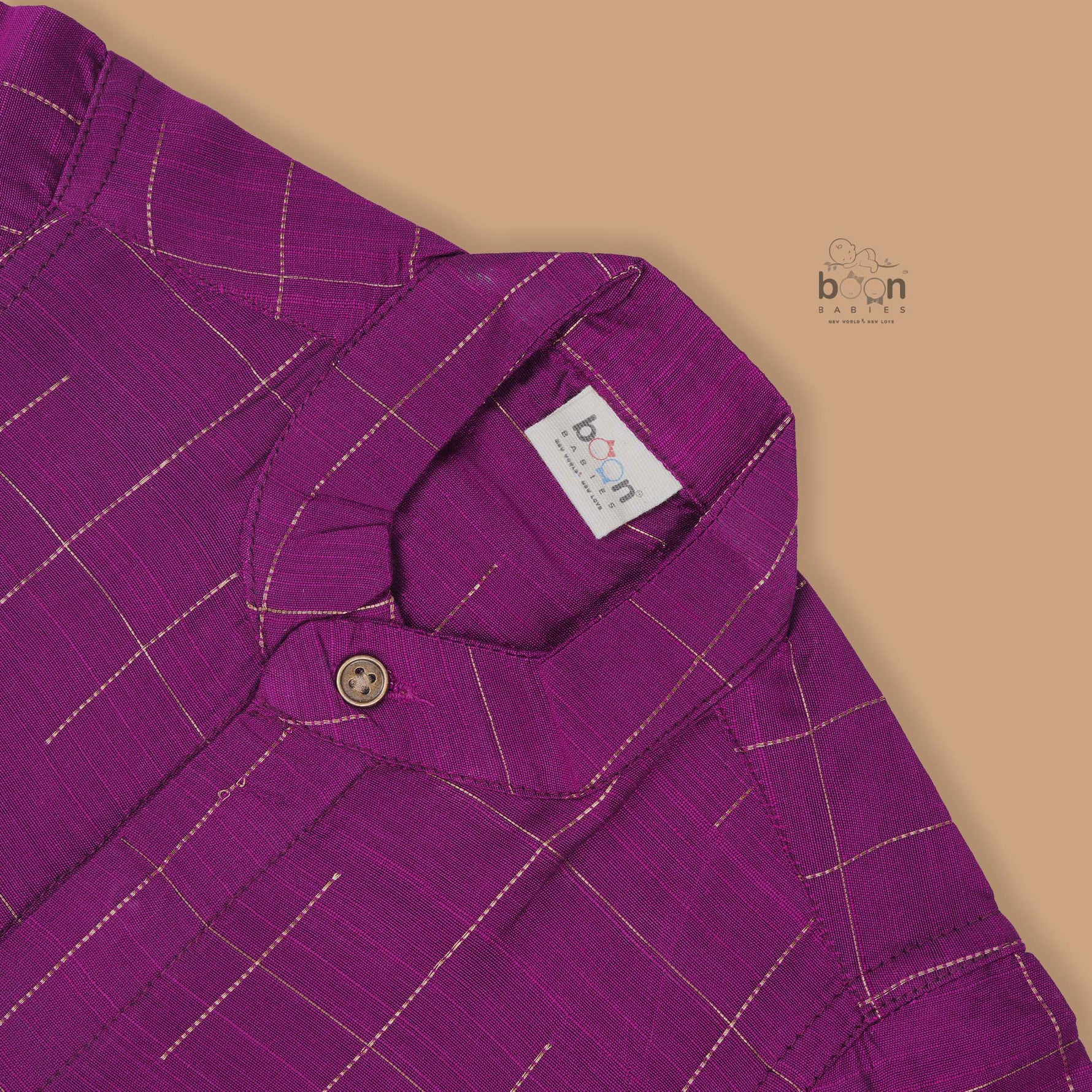 Purple checked silk shirt with Chinese collar and white dhoti with gold zari border – festive traditional wear for boys from Boon Babies.
