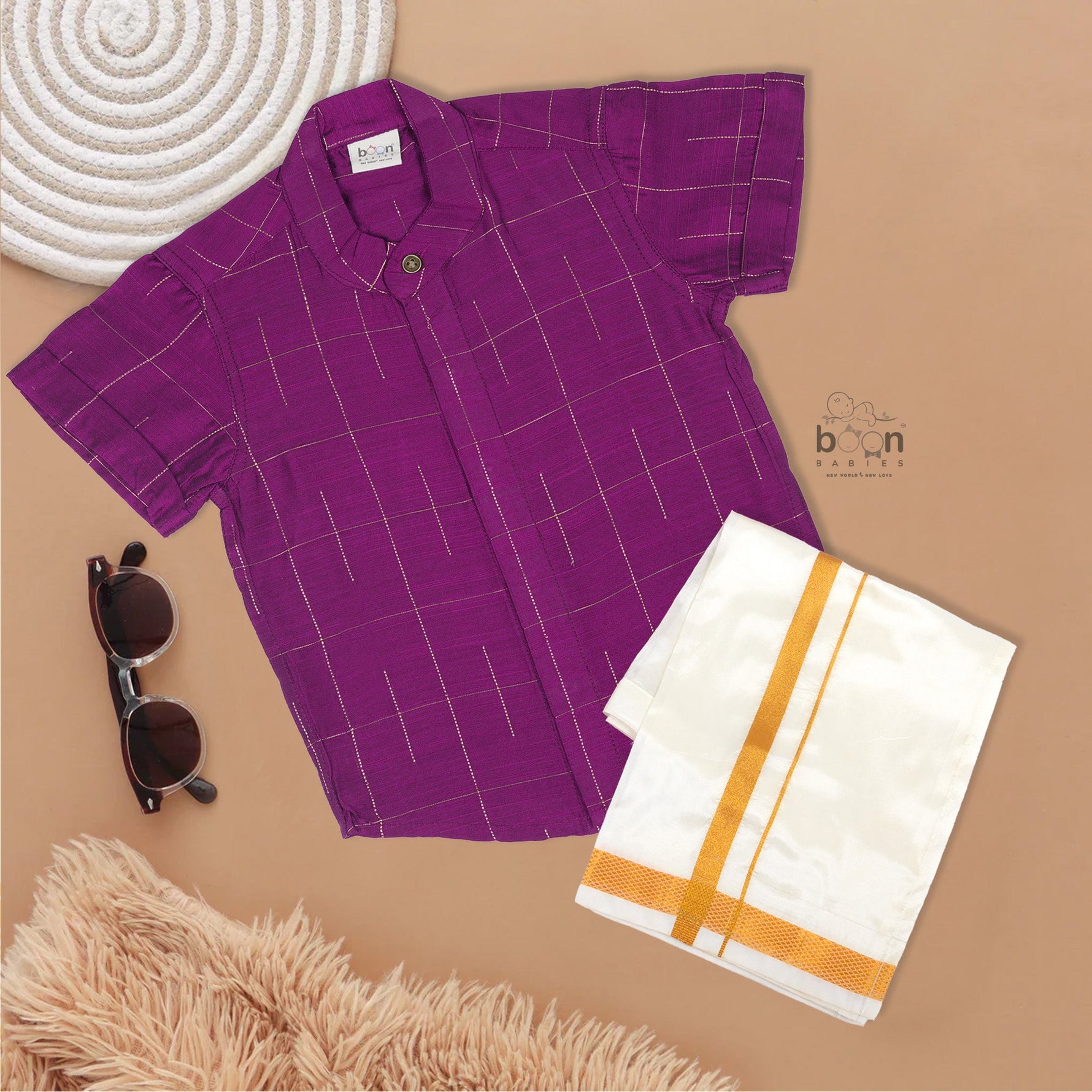 Purple checked silk shirt with Chinese collar and white dhoti with gold zari border – festive traditional wear for boys from Boon Babies.
