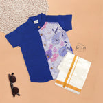 Royal blue silk panel shirt with floral embroidery paired with white pattu dhoti featuring a gold border – traditional festive outfit for boys by Boon Babies.
