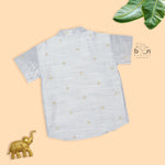 Boys’ traditional grey silk butta shirt with ivory dhoti & zari border. Elegant & comfortable festive wear for ages 6M–5Y.