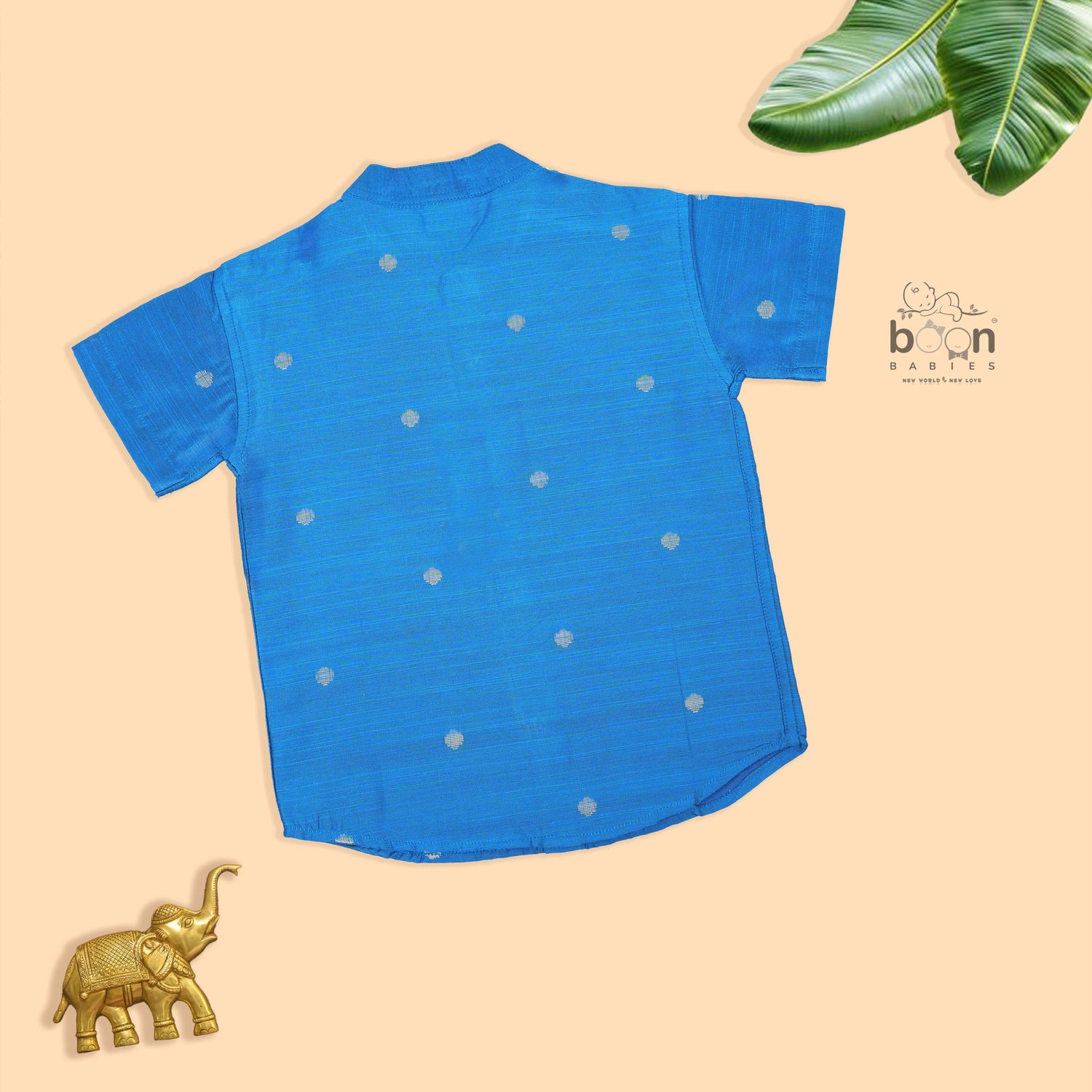 Boys’ festive Sky blue silk butta shirt with ivory dhoti & golden zari border. Traditional yet comfy outfit for ages 6M–5Y.