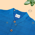 Boys’ festive Sky blue silk butta shirt with ivory dhoti & golden zari border. Traditional yet comfy outfit for ages 6M–5Y.