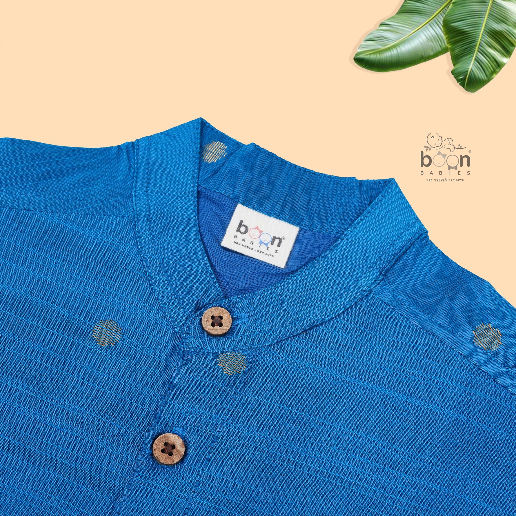 Boys’ festive Sky blue silk butta shirt with ivory dhoti & golden zari border. Traditional yet comfy outfit for ages 6M–5Y.