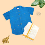Boys’ festive Sky blue silk butta shirt with ivory dhoti & golden zari border. Traditional yet comfy outfit for ages 6M–5Y.