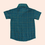 Elegant teal silk checkered shirt with golden-border dhoti — a premium, festive ethnic wear set for boys.
